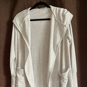 Light gray jersey sweater.